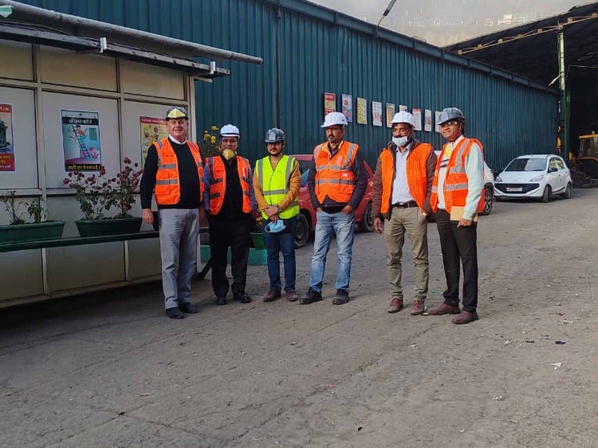 Site visit group photo in PPE at the facility entrance